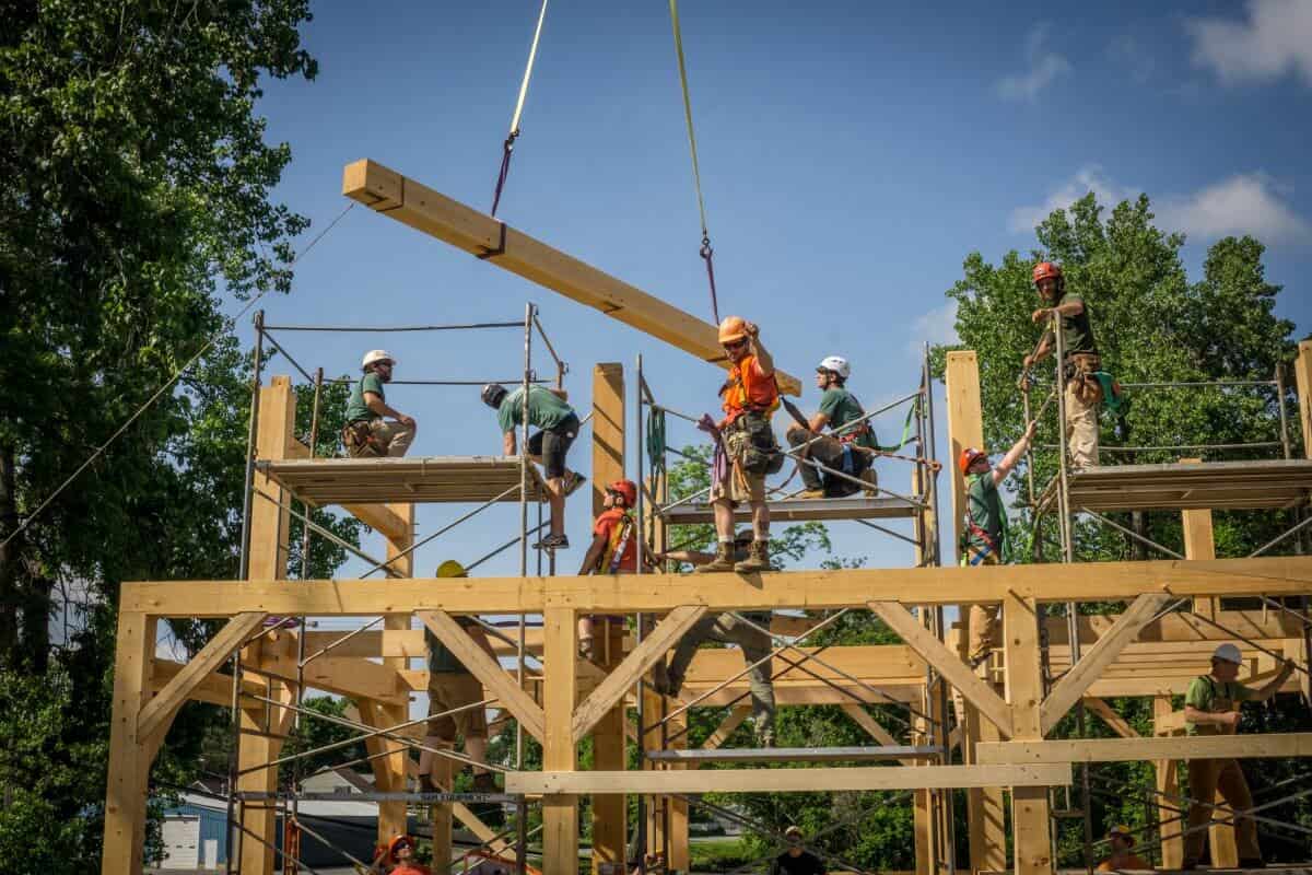 Lifting a beam at timber frame raising