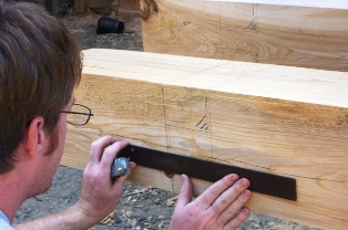Cleaning mortise joint with chisel