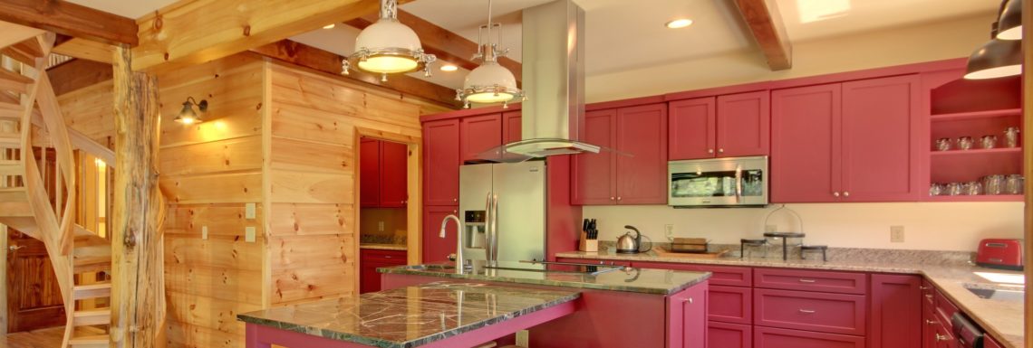 red kitchen in timber frame home