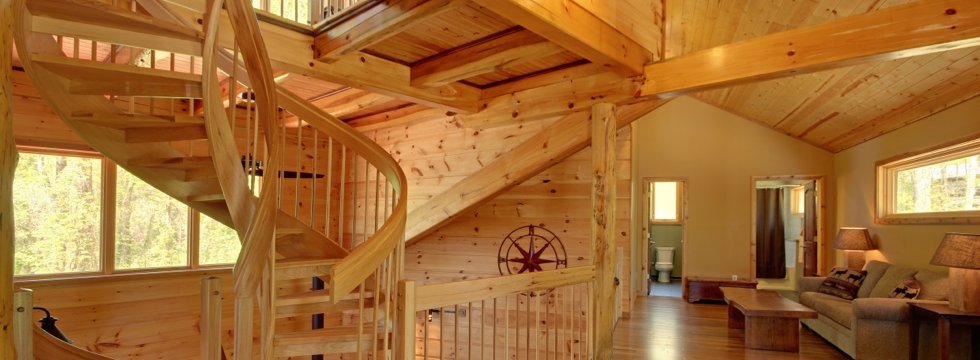 Spiral stairs and timber frame at Corkscrew Cabin in Long Creek, SC