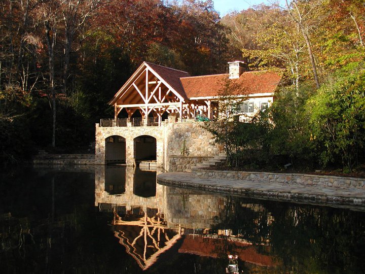 timber framed boat house with reflection