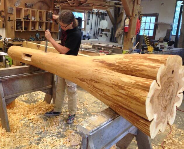 mortise being cut into cypress log post
