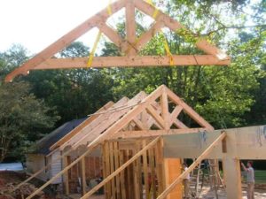 Timber frame trusses create an open and dramatic effect