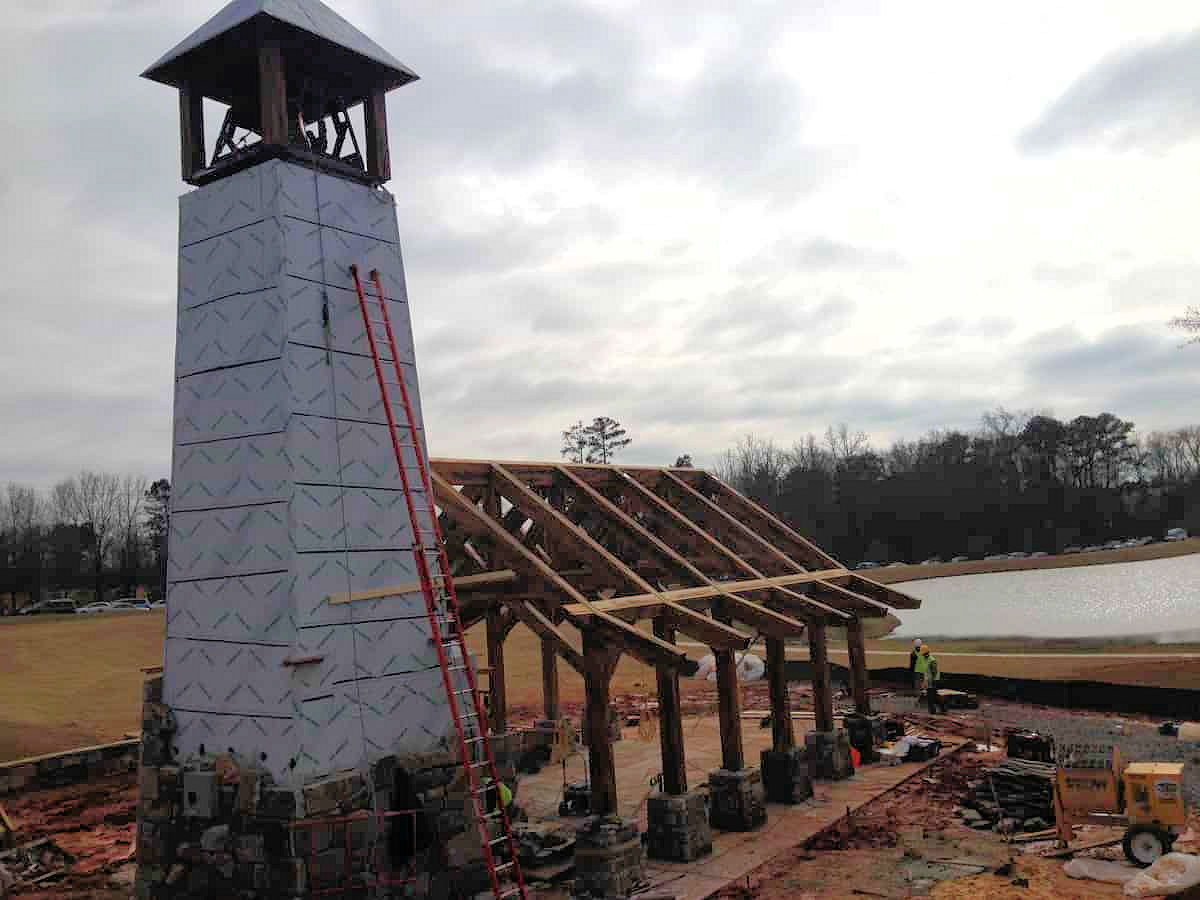 Timber framed bell tower during raising