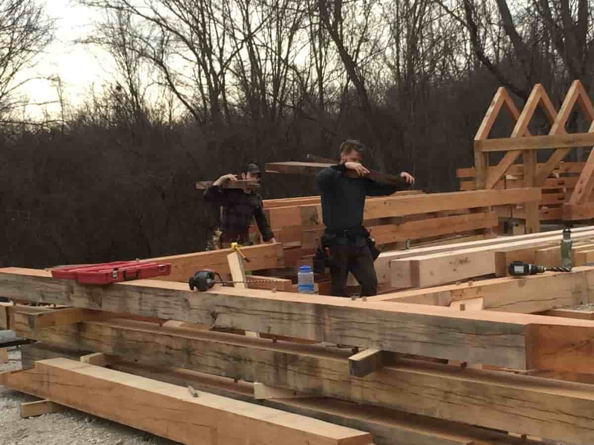 Stacking timbers in preparation to raise frame