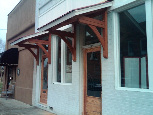 Timber framed awnings at business entrance