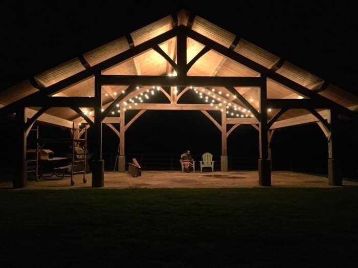 Timber frame pavilion at night