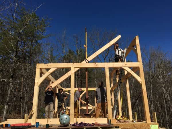 Roustabout lifting beam in timber frame cabin