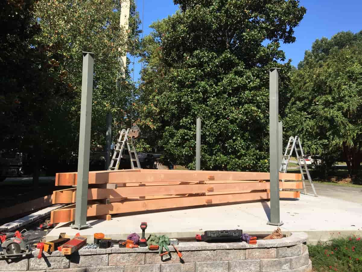 Timber frame carport trusses stacked before raising