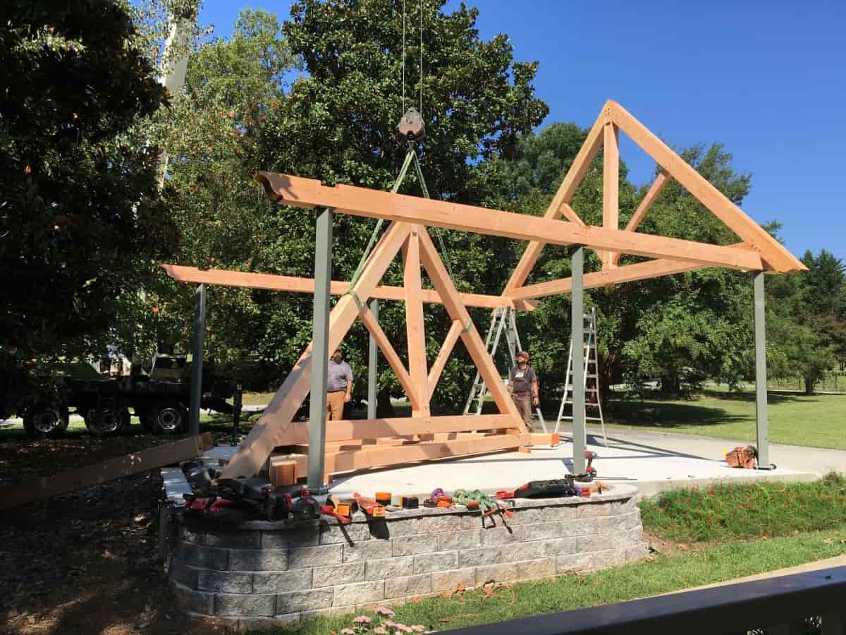 Crane lifting timber frame truss