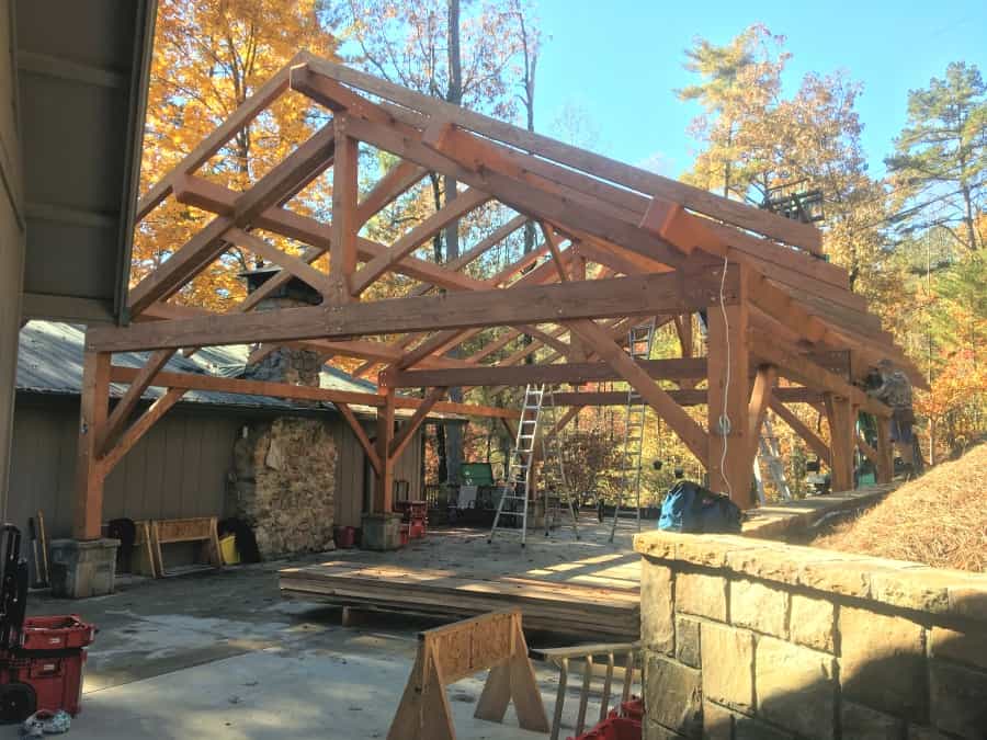 carport between house and rock wall
